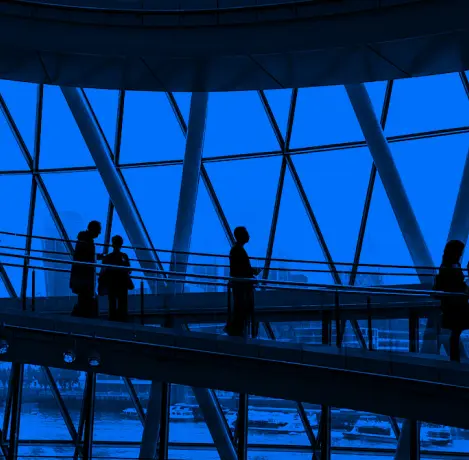 Photograph of a walkway with people on it in a duotone style